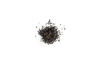 different sorts of black or green tea in bulk  on a white background close-up isolated