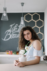 Obraz premium Portrait of a beautiful girl. Romantic shot. Young pretty happy woman in a dress. Fashion style photo of a smiling girl