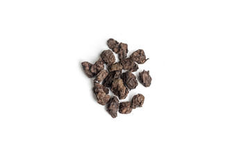 different sorts of black or green tea in bulk  on a white background close-up isolated