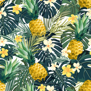 Seamless hand drawn tropical vector pattern with exotic palm leaves, hibiscus flowers, pineapples and various plants on white background.