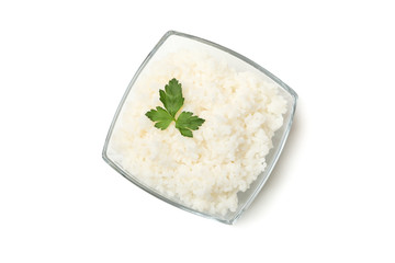 Glass bowl with boiled rice and parsley isolated on white background
