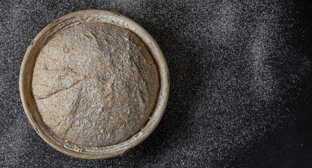 Proofing dough in a special basket. Raise the dough before baking. Yeast-free dough. The fermentation process of the dough.