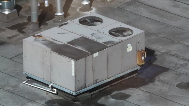 Industrial rooftop air conditioning unit. Summer in Queens, NYC, USA.