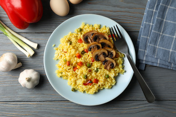 Composition with delicious rice on wooden background, top view