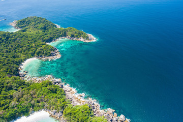Aerial view of ocean waves, Beautiful tropical beach and rocky coastline and beautiful forest. Nga Khin Nyo Gyee Island Myanmar