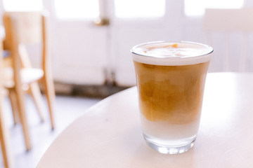 Iced coffee on a white table in a coffee shop