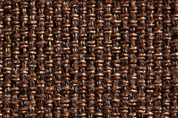 Background of knots with wool strings of brown and yellow color