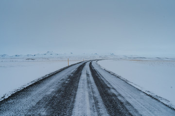 Fototapeta na wymiar Winter landscape of a beautiful and frozen Iceland. Tourism in Iceland is very popular even over the winter months and still has a lot to offer