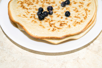 plate with rosy pancakes. Maslenitsa