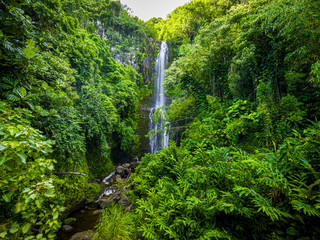 Maui, Hawaii Hana Highway - Wailua Falls, near Lihue, Kauai. Road to Hana connects Kahului to the town of Hana Over 59 bridges, 620 curves, tropical rainforest