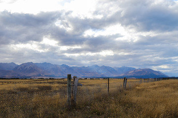 Relaxing and colorful landscape with a fence at the front