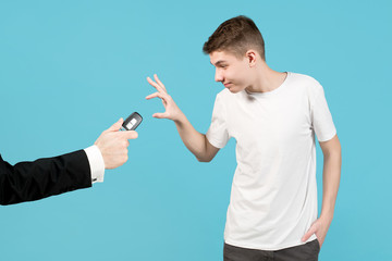 teenager happily accepts a car key, which dad give him