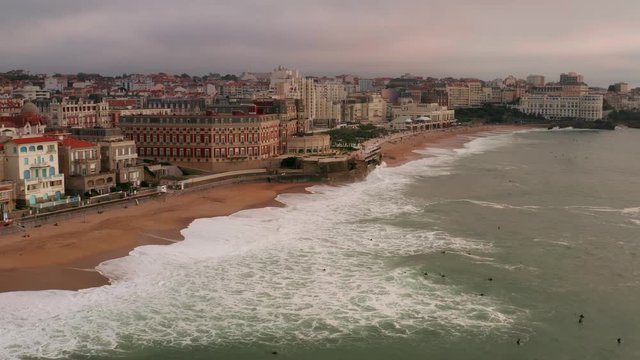 Drone flight over the sea, towards the beachfront of Biarritz, France.