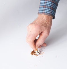 man's hand breaks a cigarette. stop smoking concept