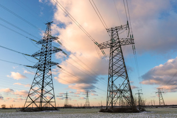 Power lines during a beautiful winter sunset.