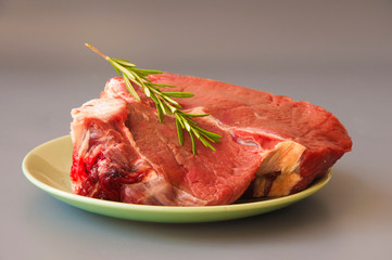 Raw beef fillet steaks with herbs and spices