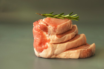 Raw beef fillet steaks with herbs and spices