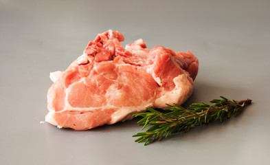 Raw pork fillet steaks on gray background