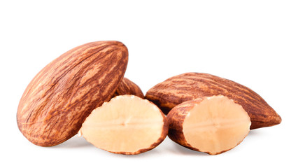 Almond whole and halves close-up on a white. Isolated