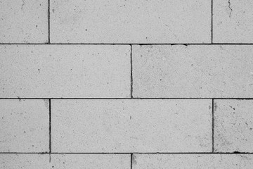 Close up shot of surface of white brick wall texture for background or devices wallpapers. Abstract design, usual, natural materials. Detailed grungy artwork. Copyspace, advertisement. Vintage style.