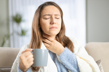 Young woman suffering from cold.