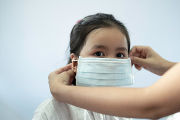 Children girl waring mask to protect Covid-19 virus and PM2.5 air pollution