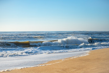 Fototapeta na wymiar Water with waves. Atlantic Ocean. Portugal. Figueira da Foz.