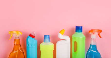 Set of cleaning products on pink background