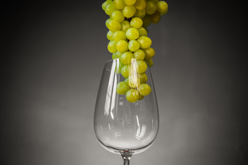 glass of white wine and grapes
