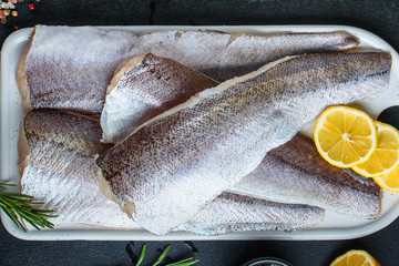 fish raw hake (set of ingredients for cooking). food background. top view. copy space