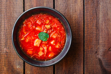 red tomato soup and vegetables and meat, borsch (Russian or Ukrainian cuisine) menu concept background. top view. copy space