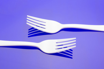 Plastic fork for casual food. White fork.