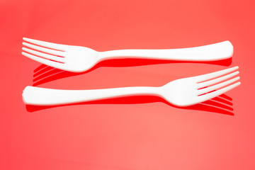 Plastic fork for casual food. White fork.