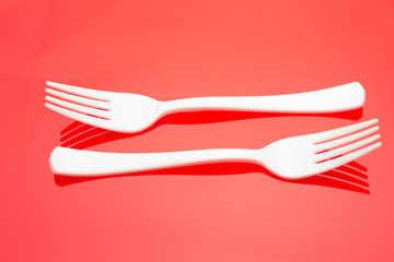 Plastic fork for casual food. White fork.