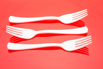 Plastic fork for casual food. White fork.
