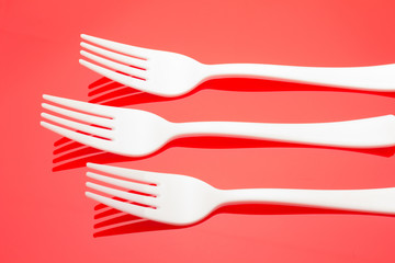 Plastic fork for casual food. White fork.