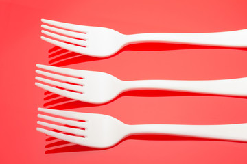 Plastic fork for casual food. White fork.