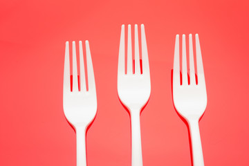 Plastic fork for casual food. White fork.