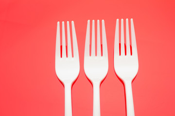 Plastic fork for casual food. White fork.