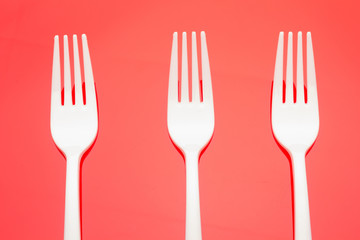 Plastic fork for casual food. White fork.