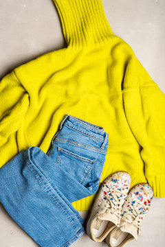 Moscow, Russia - February 2020: set of casual clothing jeans and sweater with  Maison Margiela sneakers with paint splatter details on white leather.