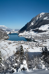 LUNGERN, SWITZERLAND - FEBRUAR 13, 2018: Panoramic winter view of the lake Lungern.