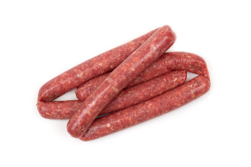 Raw sausages on a white background. Grilled sausages close-up on a white background.