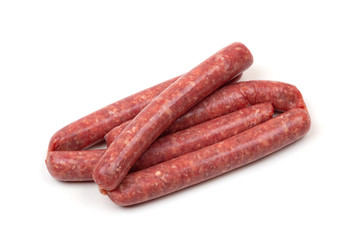 Raw sausages on a white background. Grilled sausages close-up on a white background.