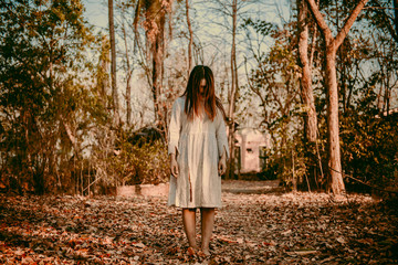 Portrait of asian woman make up ghost face with blood,Horror scene,Scary background,Halloween...