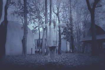 Portrait of asian woman make up ghost face with blood,Horror scene,Scary background,Halloween...