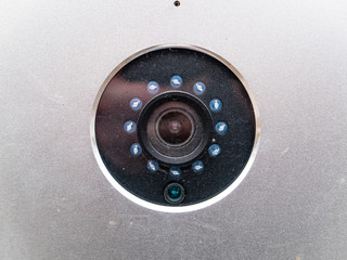The lens of the surveillance camera in a metal case. Security. Security. Police. Place for text. Technology. © malaha