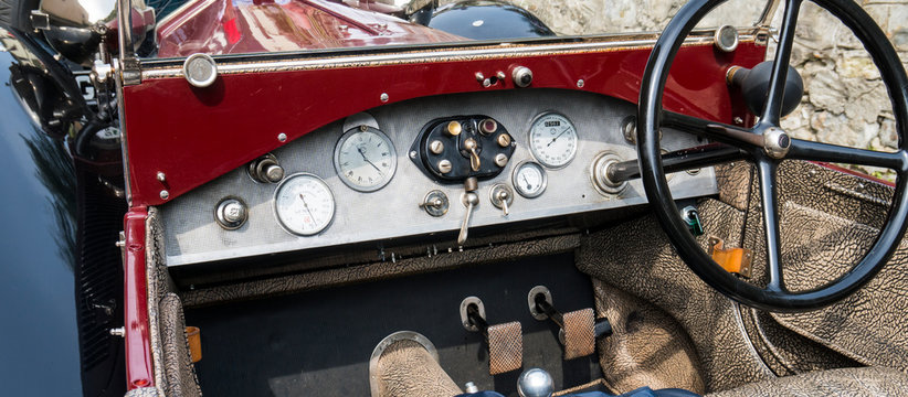 Antique car: cockpit of a Lancia Lambda at the international classic car rally in Fobello, the birthplace of Vincenzo Lancia, the founder of the car company. Fobello, Italy, September 03, 2016.