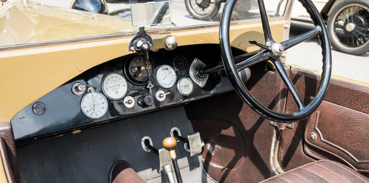 Antique car: cockpit of a Lancia Lambda at the international classic car rally in Fobello, the birthplace of Vincenzo Lancia, the founder of the car company. Fobello, Italy, September 03, 2016.