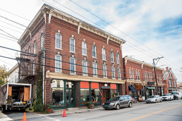 Old American brick buildings with stores on the ground floor along a street in a mountain town